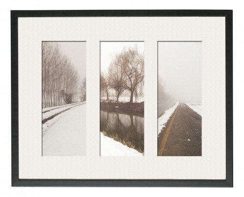 Tres fotografías enmarcadas en blanco y negro de una carretera nevada capturadas por un fotógrafo de arquitectura.