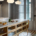 Una cocina con gabinetes de madera y una isla de madera, bellamente capturada por un talentoso fotógrafo especializado en renovaciones de diseño de interiores.